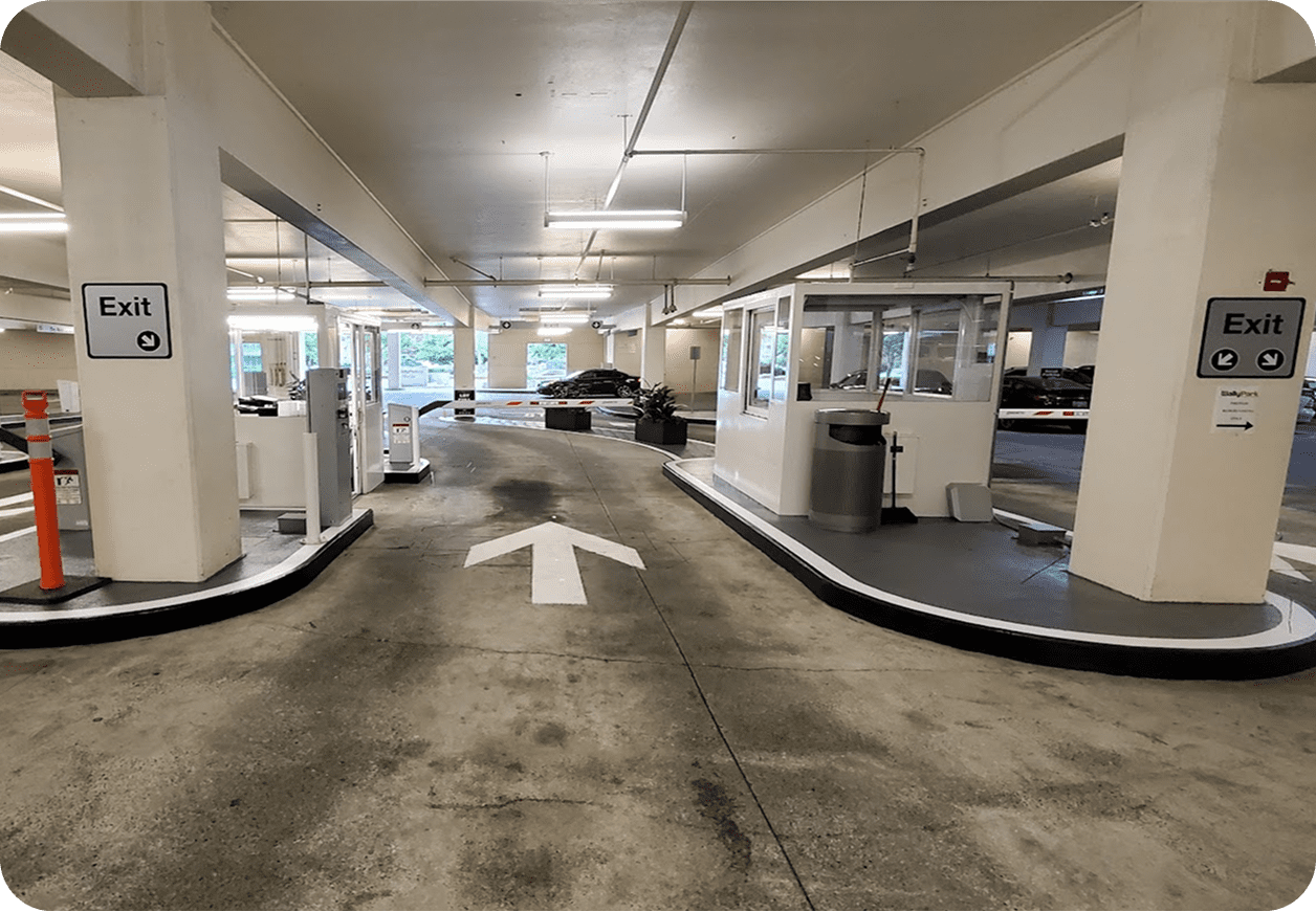 Parking garage exit with directional arrow.